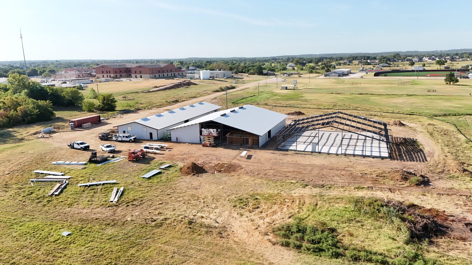 Callisburg ISD aerial view of the three buildings under construction beside the school campus