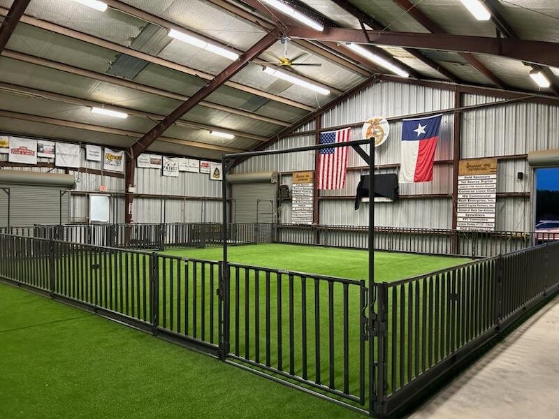 Turf-floored display pens inside the finished Judson ISD show barn